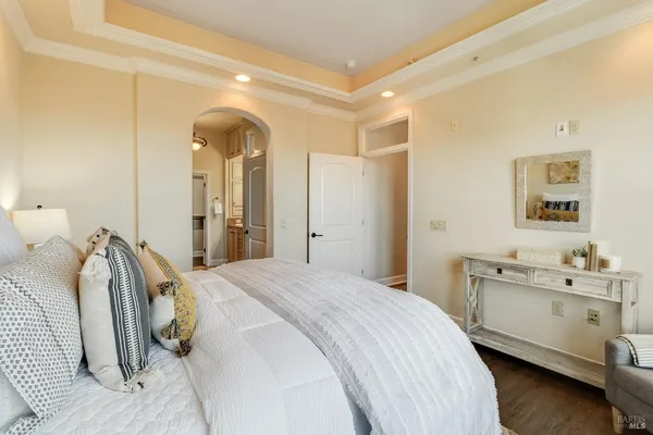a spacious bathroom with a double vanity sink a mirror and a shower
