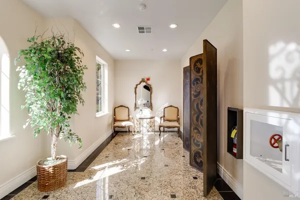 a living room with furniture and a large window