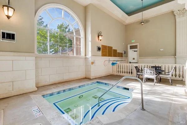 a room with wooden floor and furniture