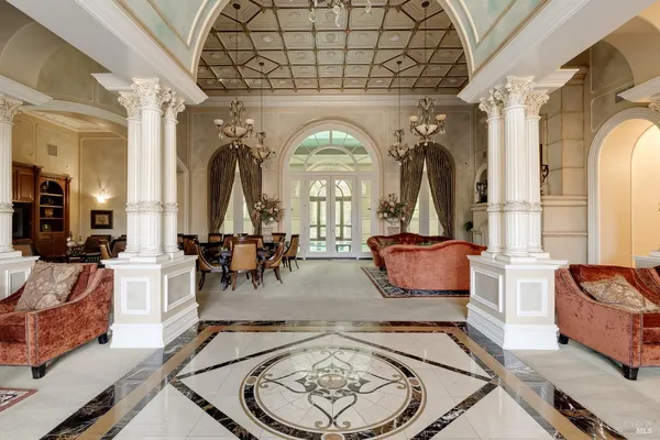 a living room with furniture and a bookshelf