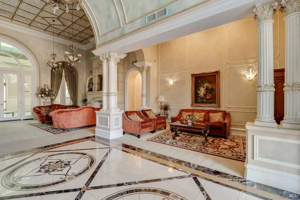a bathroom with a granite countertop sink toilet a mirror and shower