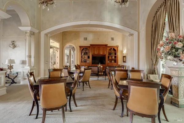 a view of a patio with a table and chairs