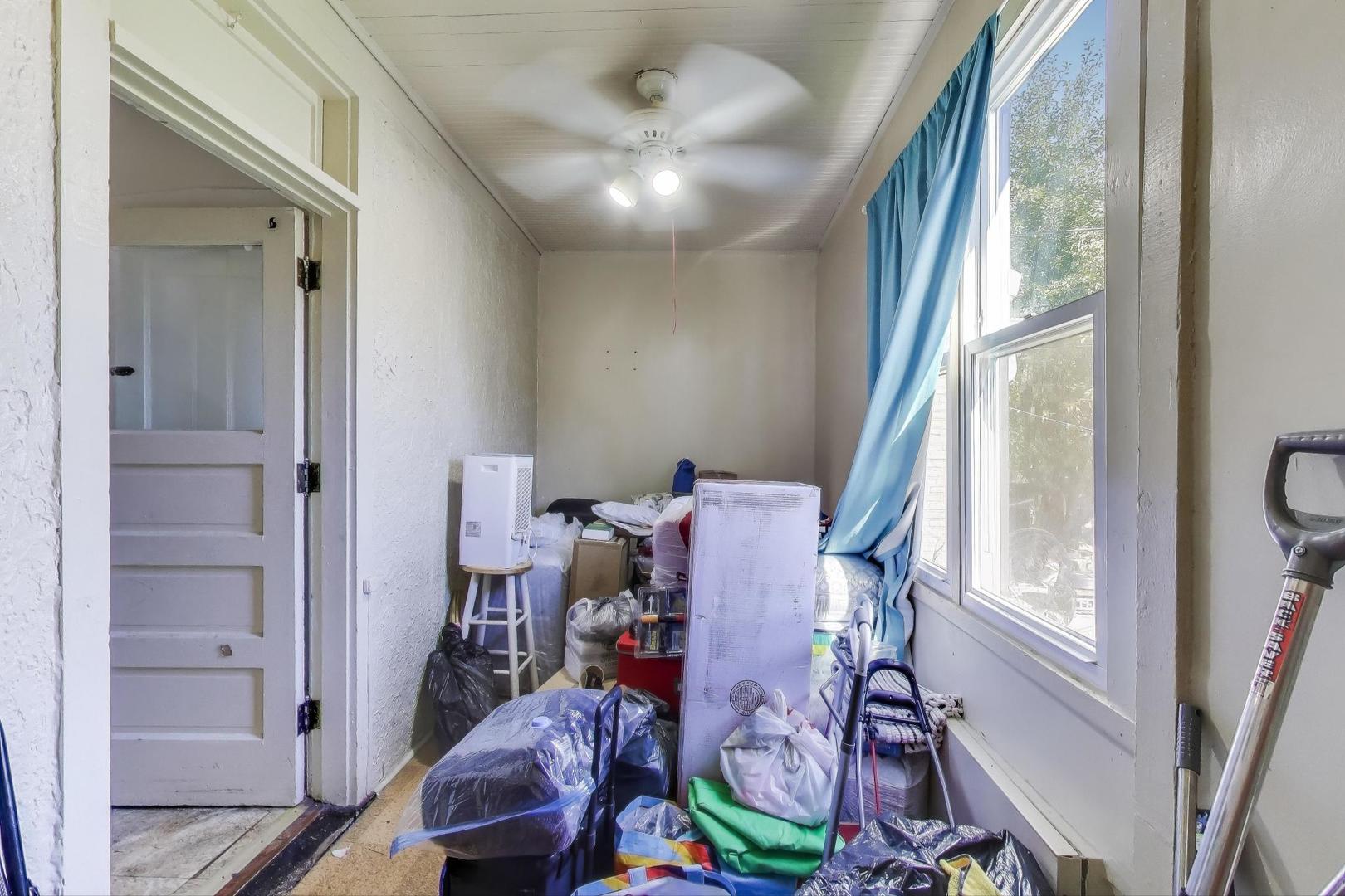 3449 North Kostner Avenue Chicago, IL 60641 - Photo 8 of 28 a view of a room with furniture and a window
