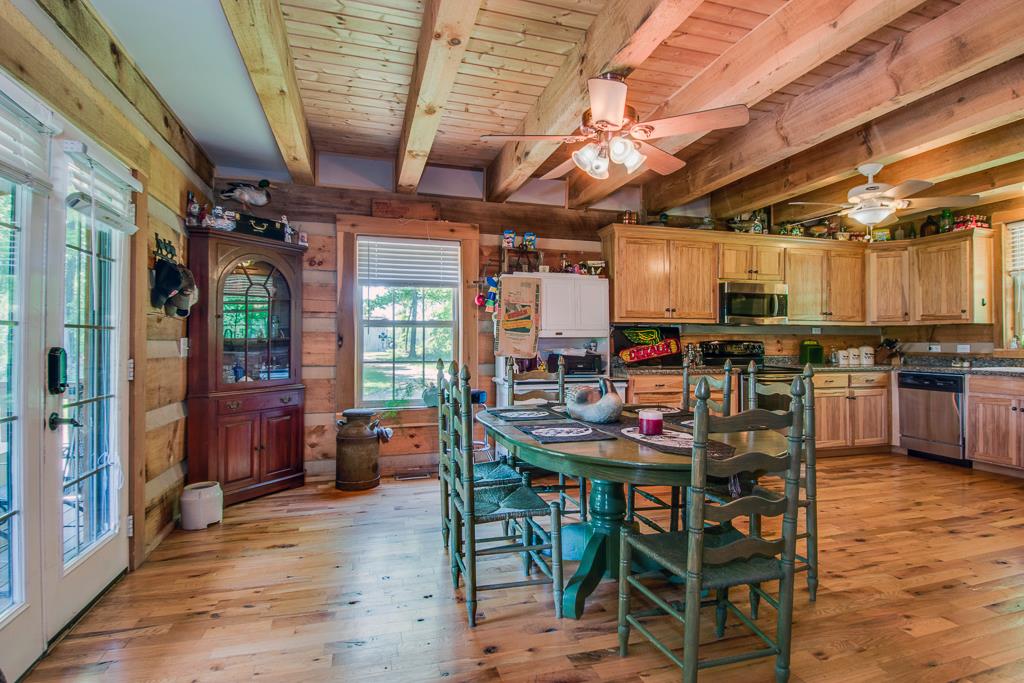 4038 Wells Road Springfield, TN 37172 - Photo 14 of 30 a view of a dining room with furniture window and wooden floor
