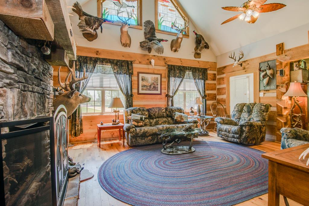 4038 Wells Road Springfield, TN 37172 - Photo 7 of 30 a living room with fireplace furniture and a wooden floor