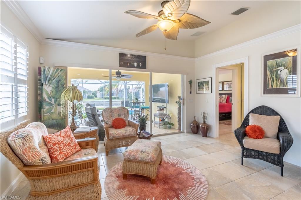 7568 Novara Court Naples, FL 34114 - Photo 18 of 34 a living room with furniture and a window
