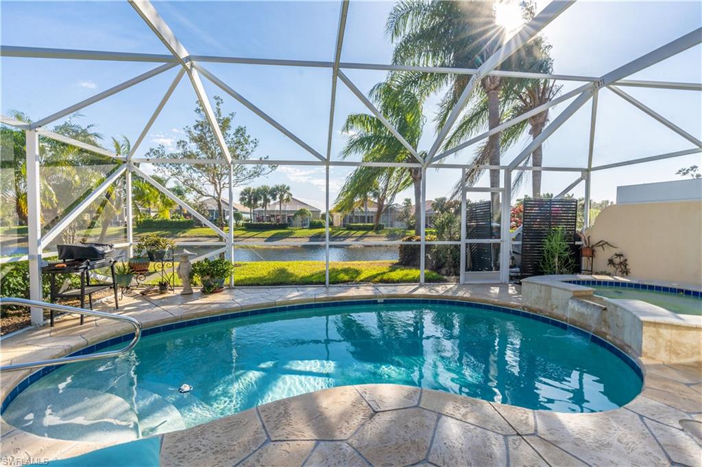 7568 Novara Court Naples, FL 34114 - Photo 28 of 34 a view of an house with swimming pool