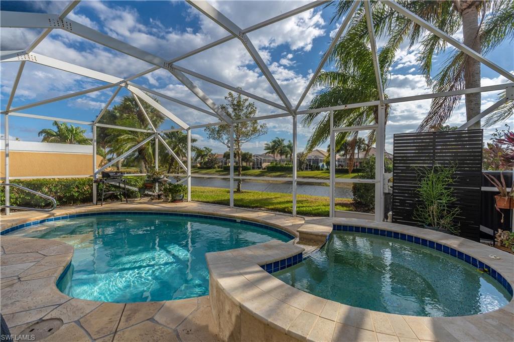 7568 Novara Court Naples, FL 34114 - Photo 31 of 34 a view of swimming pool with a patio