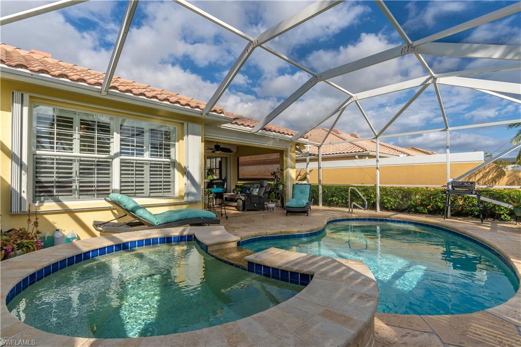 7568 Novara Court Naples, FL 34114 - Photo 32 of 34 a view of swimming pool with a lounge chairs