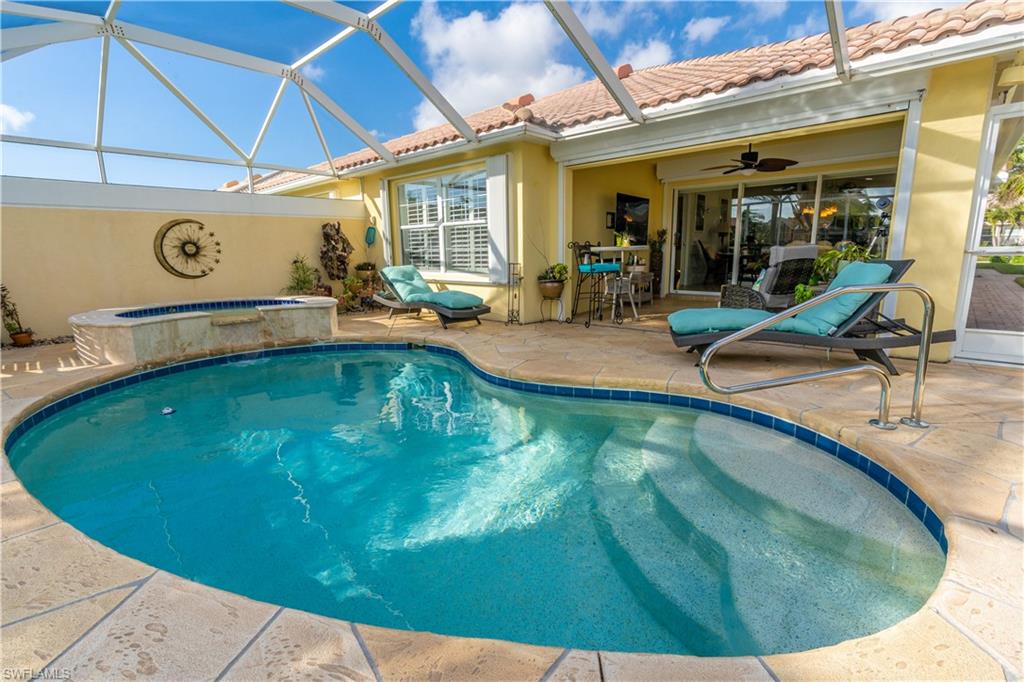 7568 Novara Court Naples, FL 34114 - Photo 33 of 34 a view of a swimming pool with a patio