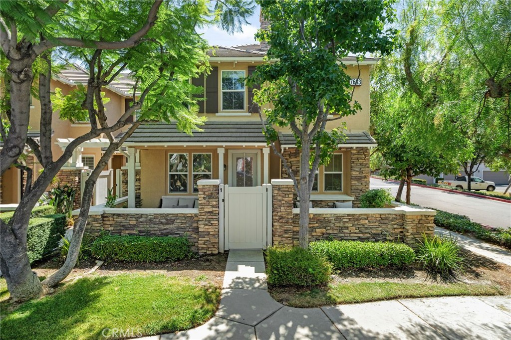 7693 Hess Place, Unit 1 Rancho Cucamonga, CA 91739 - Photo 1 of 1 front view of house with a yard