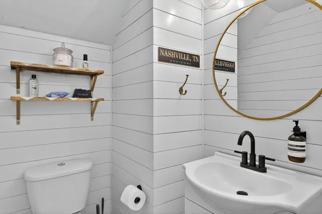 a view of a hallway with wooden floor and entryway