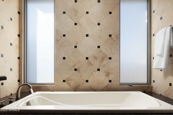 a bathroom with a bathtub and a sink