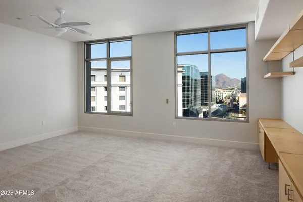 a view of livingroom with furniture window and front door