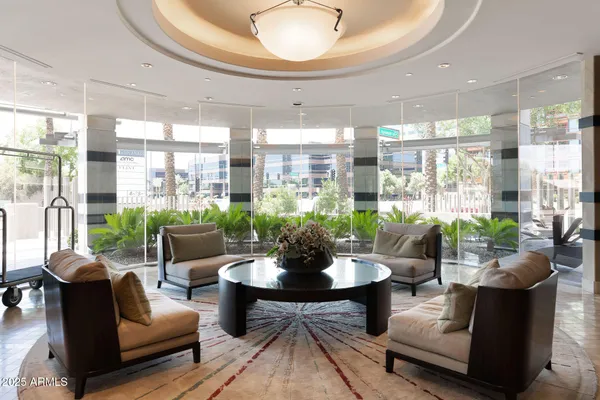 a living room with furniture and a large window