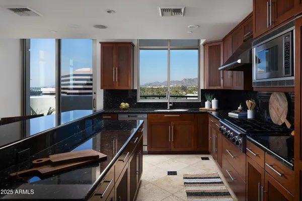 a kitchen with a sink stove and cabinets