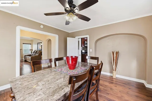 a view of a dining room with furniture and wooden floor