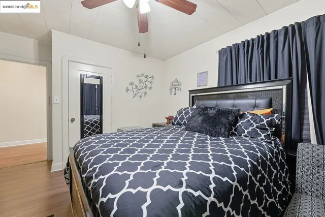 a large bed with a black and white comforter
