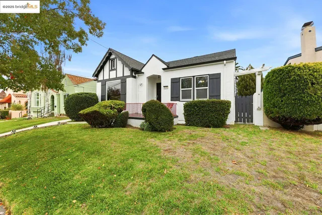 a front view of a house with garden