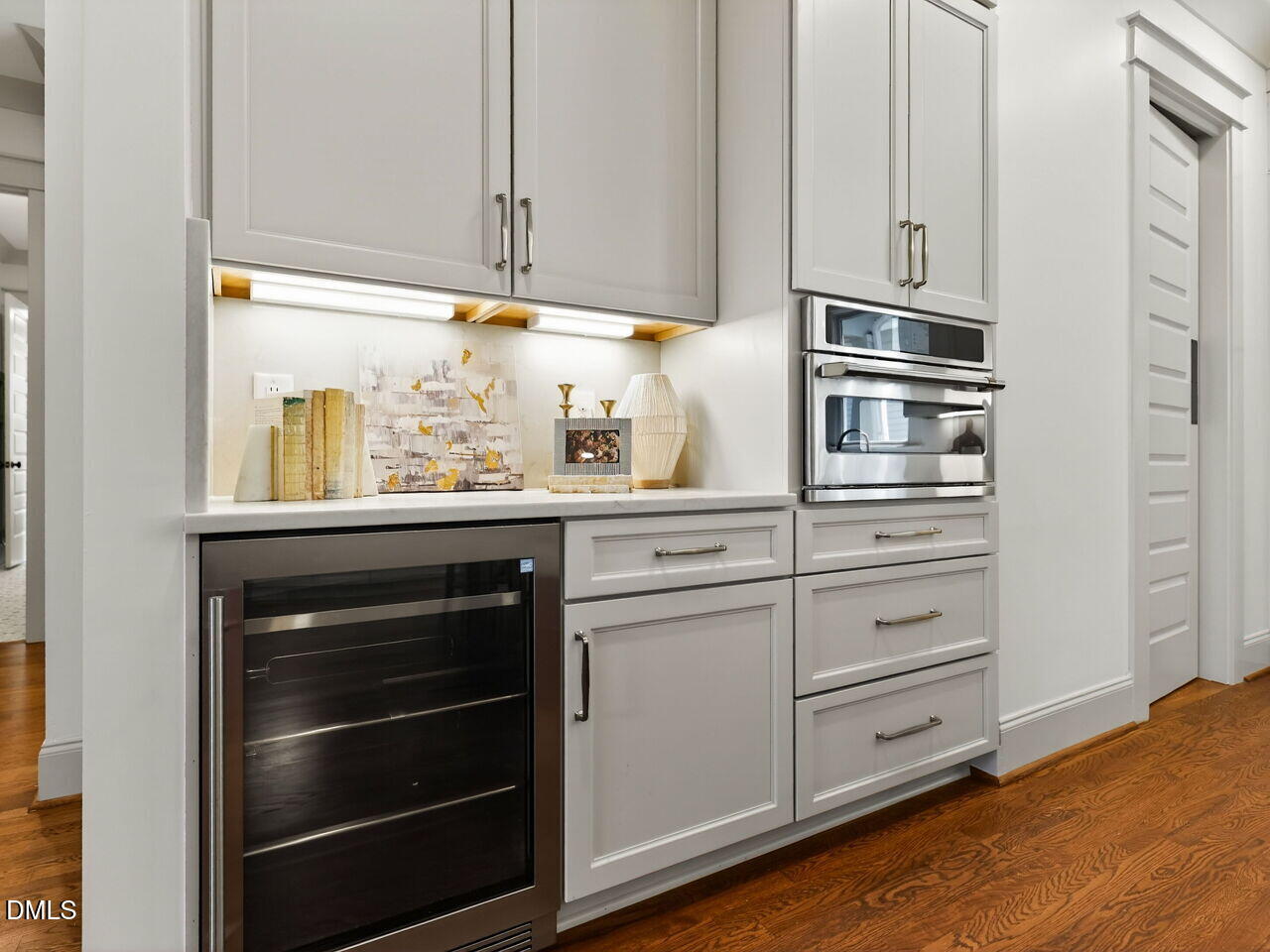 504 Tilden Street Raleigh, NC 27605 - Photo 27 of 58 a kitchen with appliances cabinets and a wooden floor