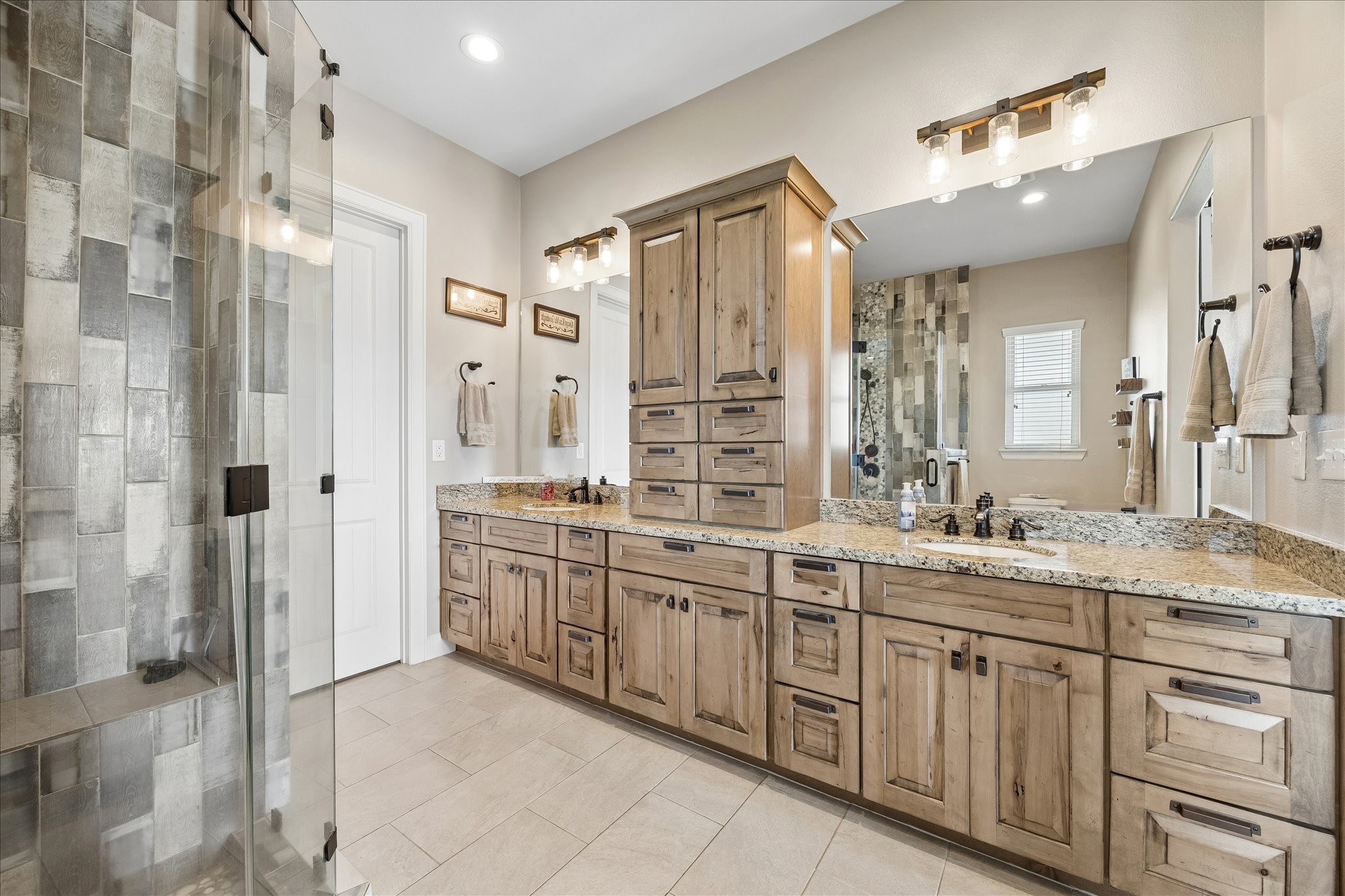 2224 Maler Road Sealy, TX 77474 - Photo 23 of 50 Primary Bathroom with beautiful wooden cabinetry.