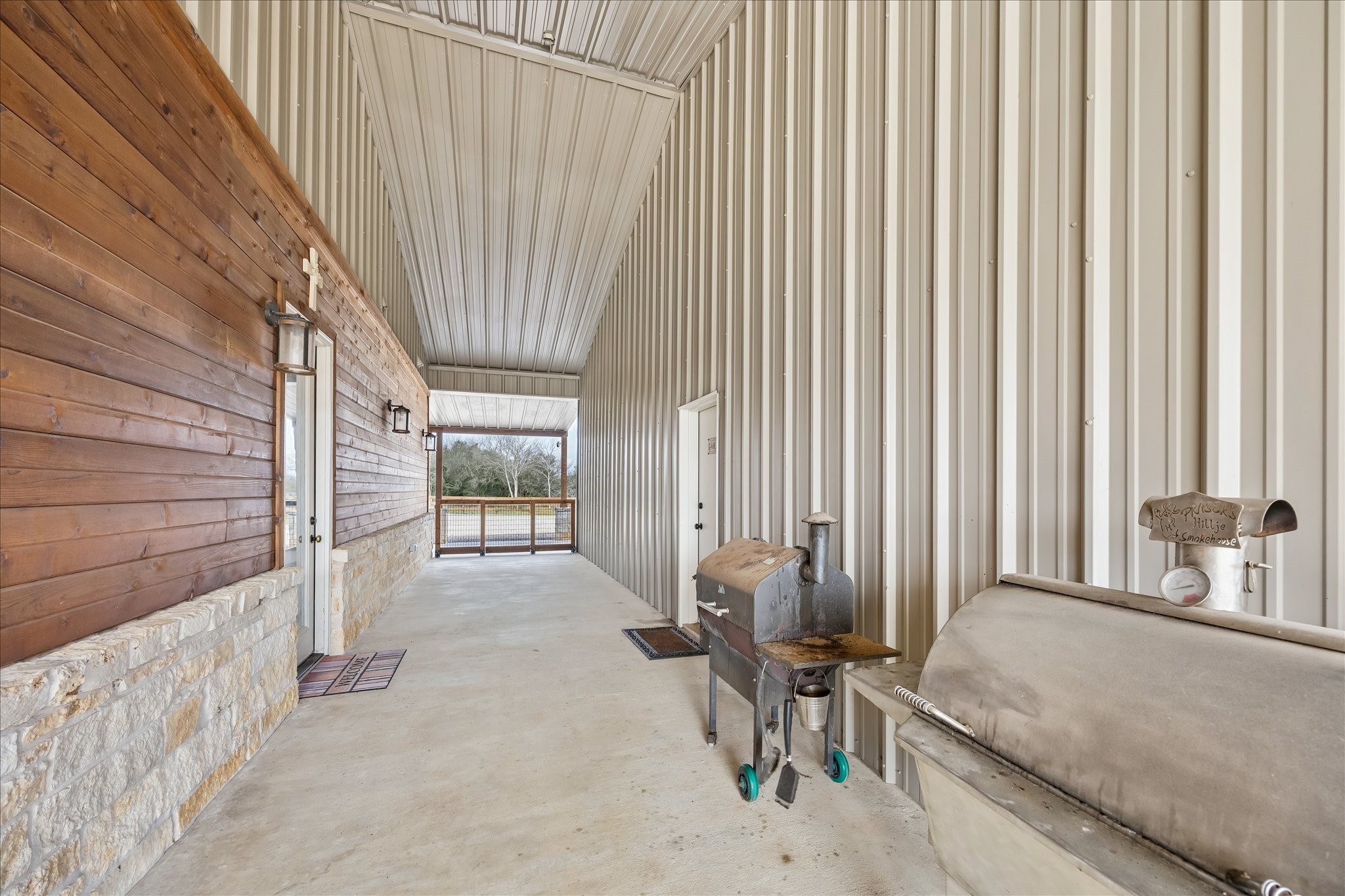 2224 Maler Road Sealy, TX 77474 - Photo 31 of 50 Covered Breezeway between the home and garage/barn space.