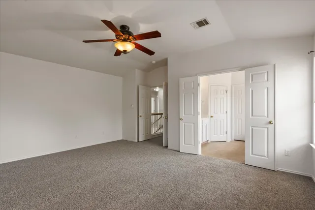 a view of empty room with fan