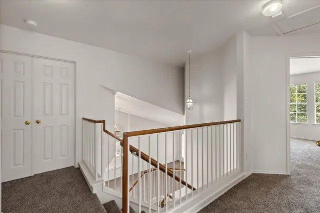 a view of staircase with rug floor