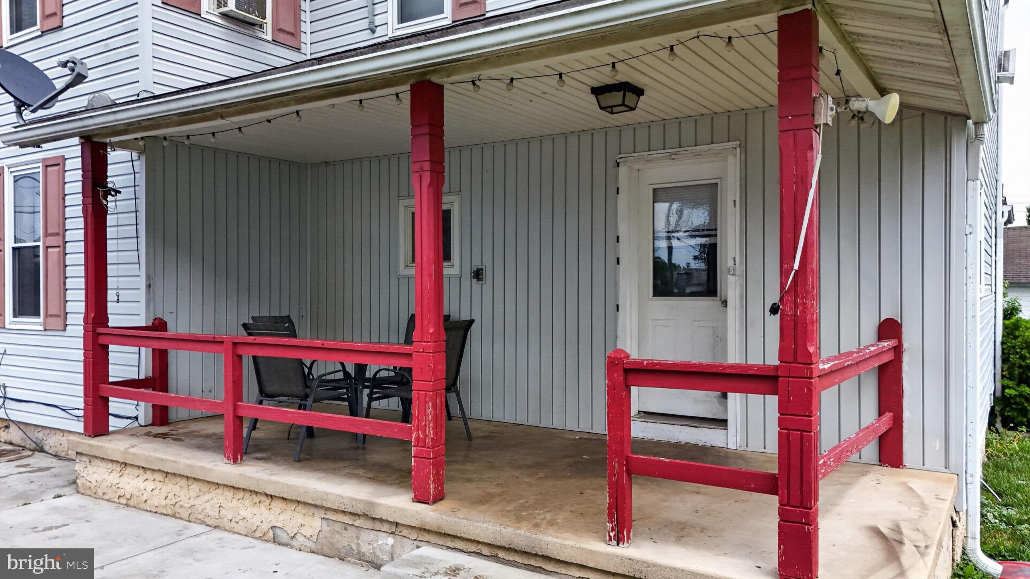 14 North Kinzer Road Kinzers, PA 17535 - Photo 22 of 34 Charming porch with vibrant red accents.