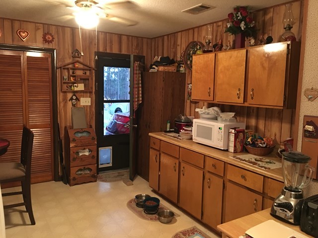 3512 Warpath Road Macon, GA 31217 - Photo 15 of 21 a kitchen with refrigerator and cabinets