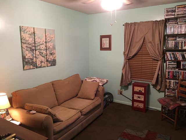 3512 Warpath Road Macon, GA 31217 - Photo 20 of 21 a living room with furniture and a book shelf