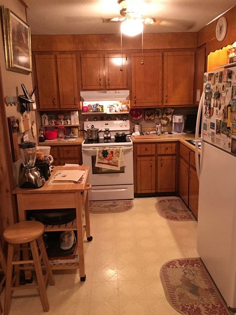 3512 Warpath Road Macon, GA 31217 - Photo 5 of 21 a kitchen with a sink a stove and chairs