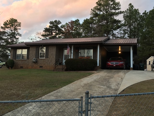 3512 Warpath Road Macon, GA 31217 - Photo 8 of 21 a front view of a house with a yard and garage