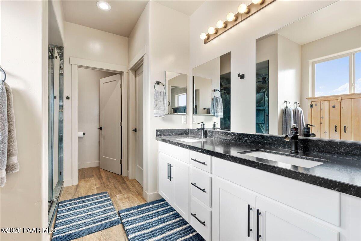 22367 North Malapai Ridge Road Paulden, AZ 86334 - Photo 11 of 23 a spacious bathroom with a double vanity sink and a mirror