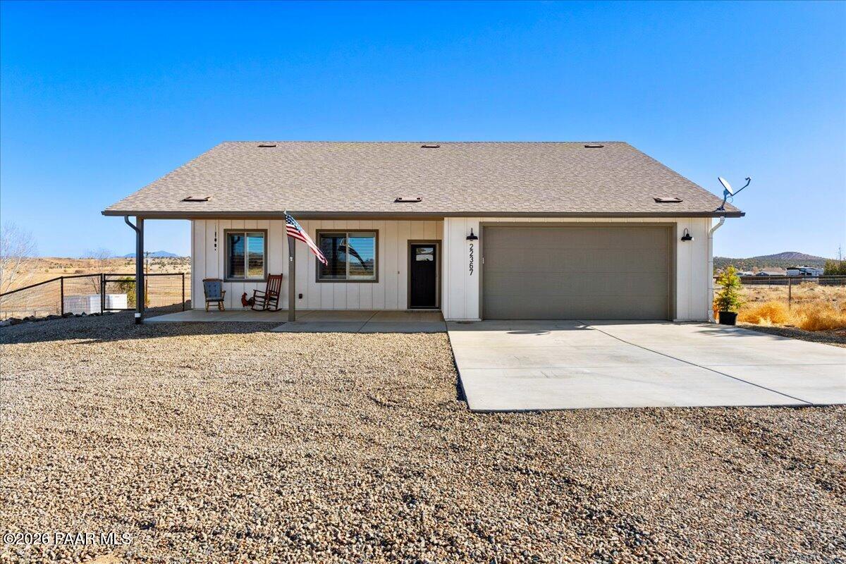 22367 North Malapai Ridge Road Paulden, AZ 86334 - Photo 2 of 23 a front view of a house with a yard