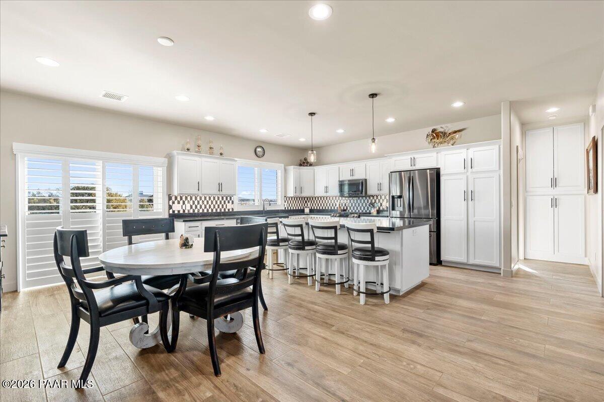 22367 North Malapai Ridge Road Paulden, AZ 86334 - Photo 6 of 23 a view of a dining room with furniture and wooden floor