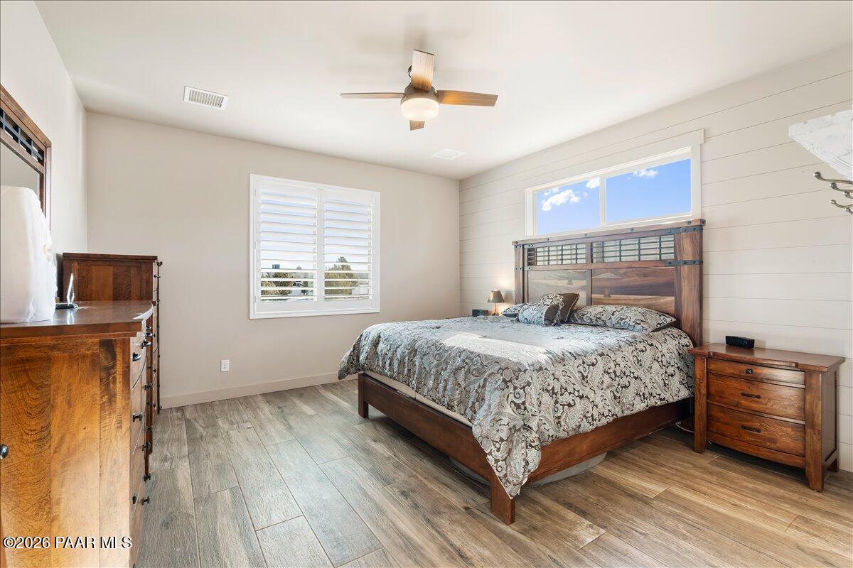 22367 North Malapai Ridge Road Paulden, AZ 86334 - Photo 9 of 23 a bedroom with a bed and a window