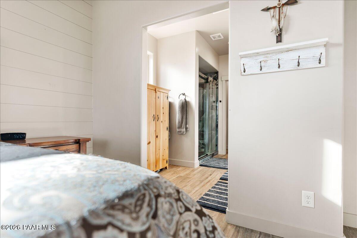 22367 North Malapai Ridge Road Paulden, AZ 86334 - Photo 10 of 23 a bedroom with a bed and a window