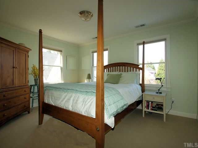 604 Leonidas Court Raleigh, NC 27604 - Photo 9 of 12 This sunny bedroom overlooks the cute cul-de-sac and the charming homes located across the street. Bedroom