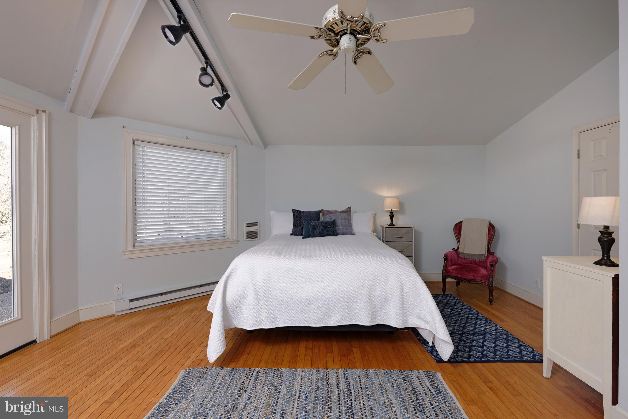 1608 Zulla Road Middleburg, VA 20117 - Photo 17 of 52 a bedroom with a bed and wooden floor
