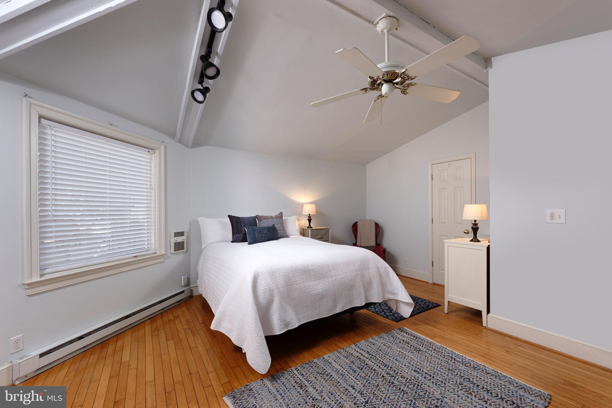 1608 Zulla Road Middleburg, VA 20117 - Photo 18 of 52 a bedroom with a bed and a ceiling fan