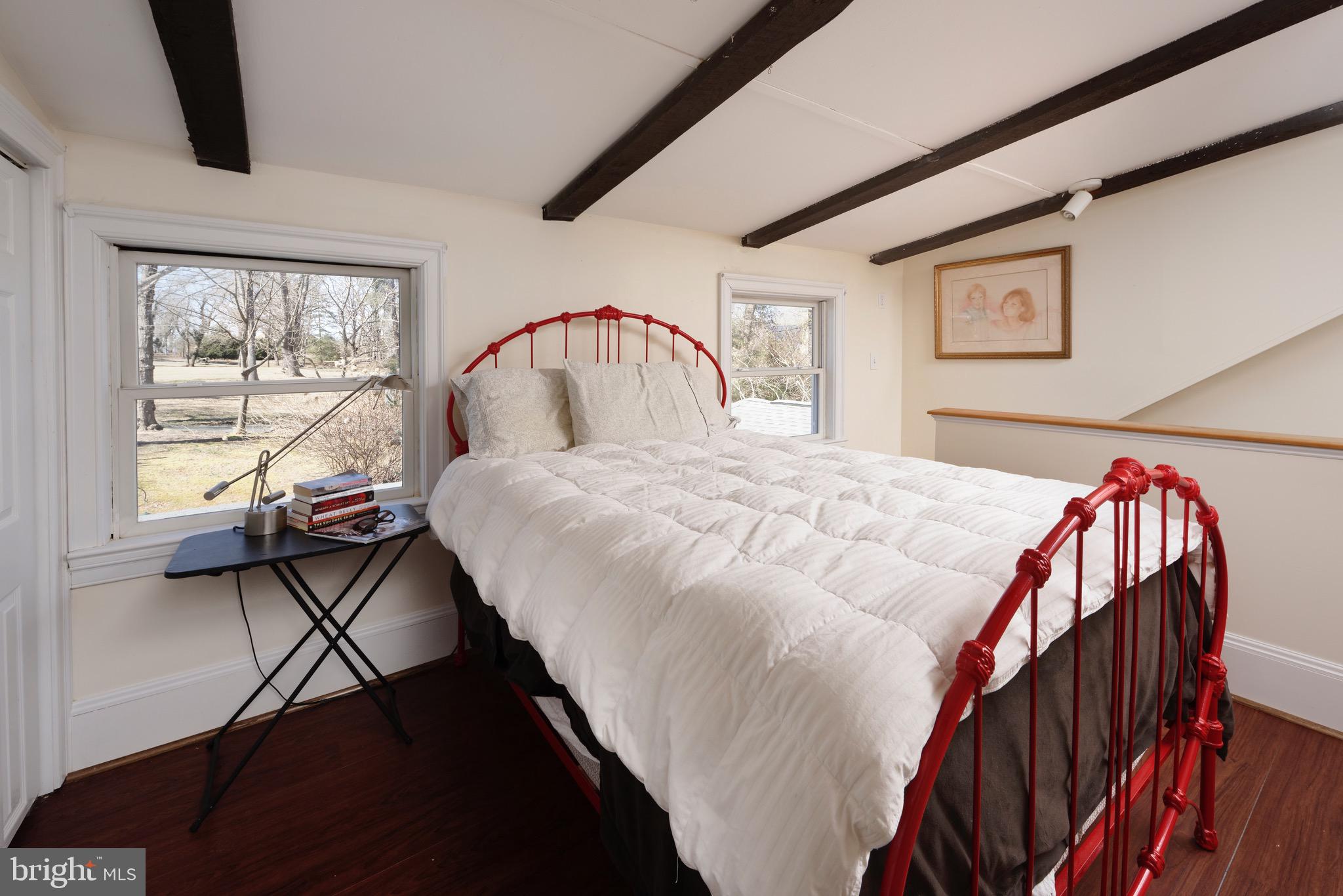 1608 Zulla Road Middleburg, VA 20117 - Photo 30 of 52 a bed sitting in a bedroom next to a window