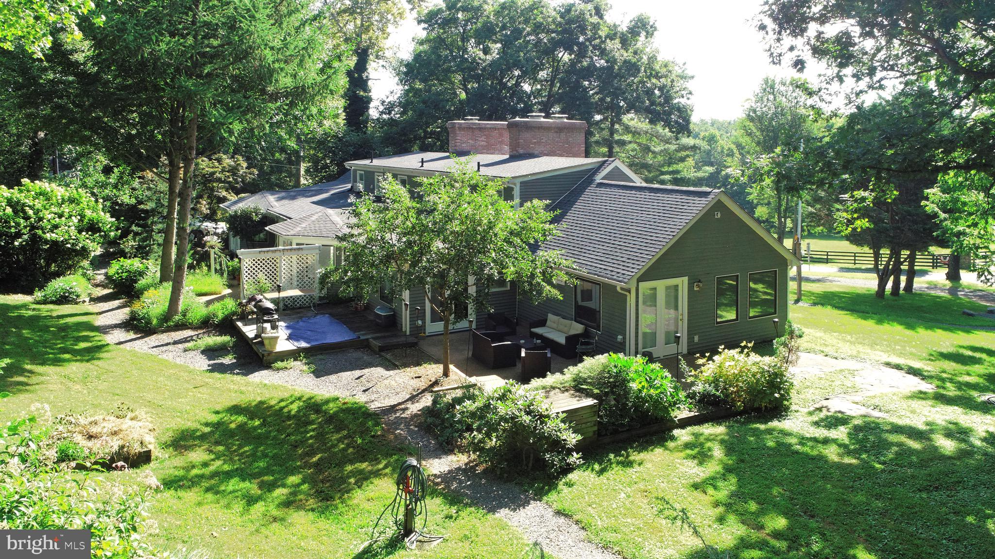 1608 Zulla Road Middleburg, VA 20117 - Photo 5 of 52 a backyard of a house with yard and outdoor seating