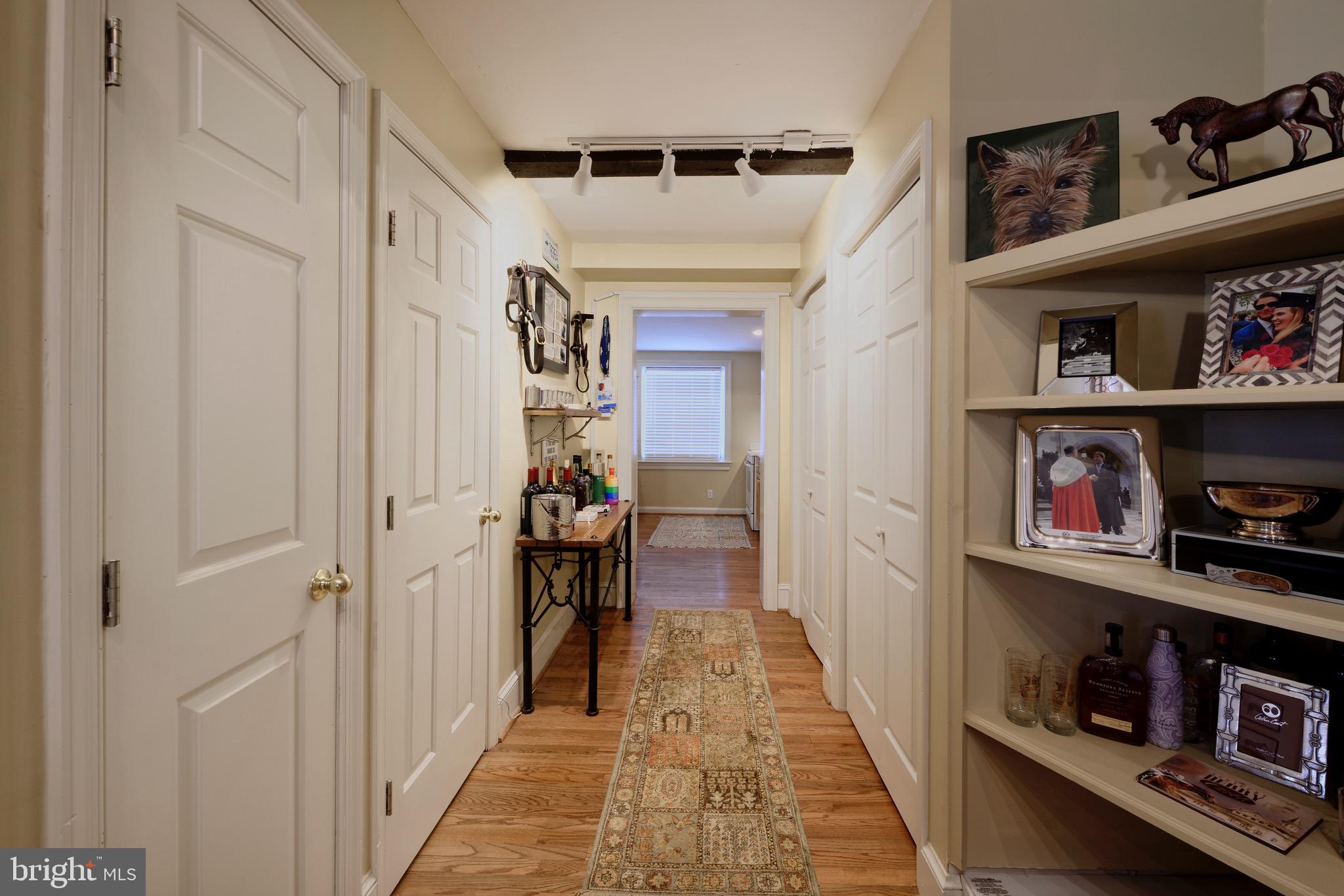 1608 Zulla Road Middleburg, VA 20117 - Photo 8 of 52 a hallway with wooden floor and shoes