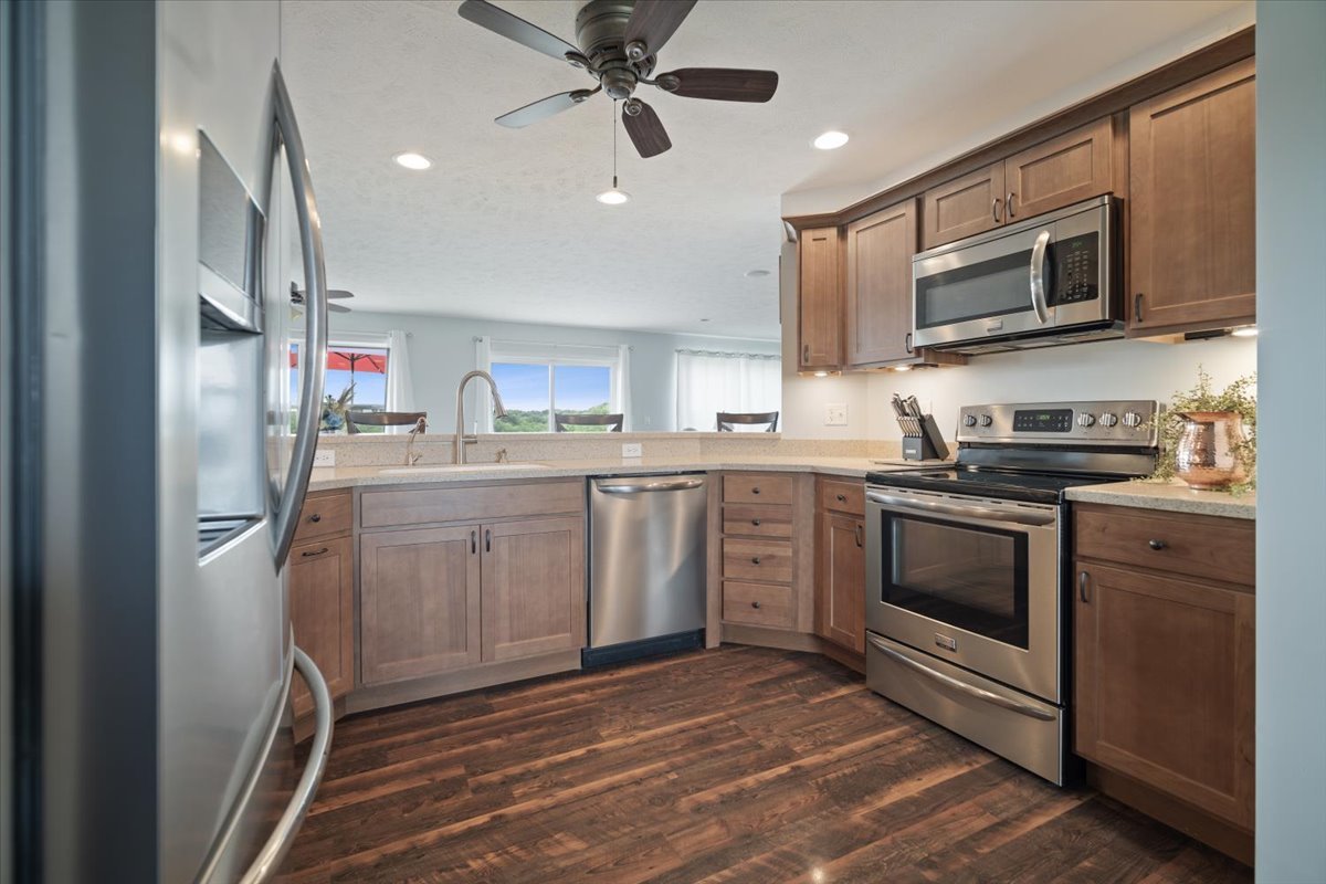 10901 Lake Road Dewitt, IL 61735 - Photo 11 of 30 a kitchen with stainless steel appliances a stove microwave and a sink