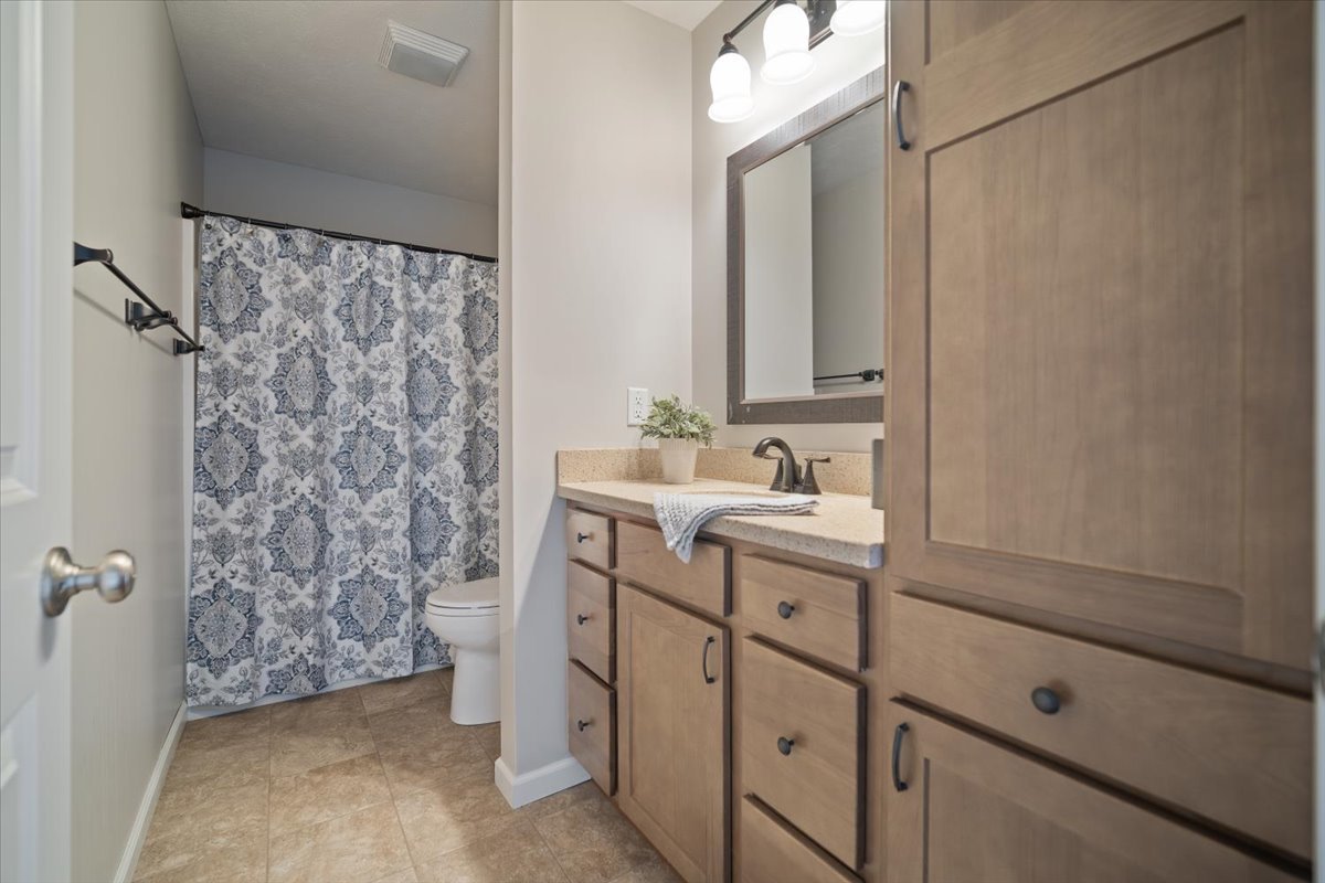 10901 Lake Road Dewitt, IL 61735 - Photo 17 of 30 a bathroom with a sink and a mirror