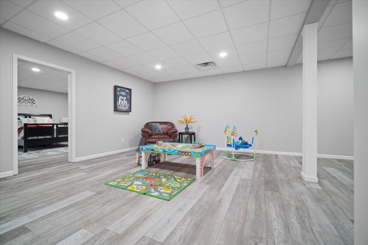 10901 Lake Road Dewitt, IL 61735 - Photo 25 of 30 a bedroom with furniture and a wooden floor