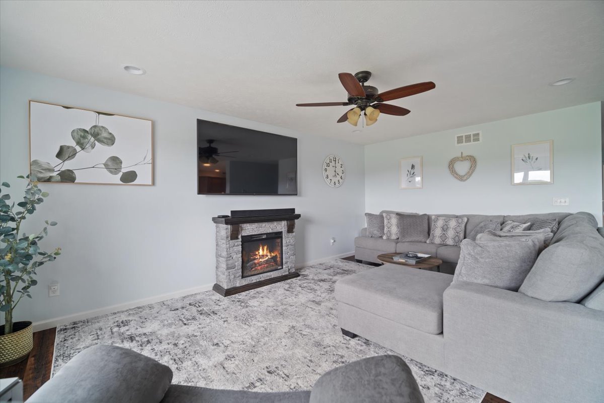 10901 Lake Road Dewitt, IL 61735 - Photo 8 of 30 a living room with furniture and a fireplace