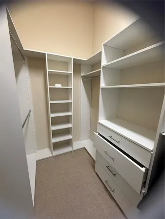 a living room with furniture and a ceiling fan