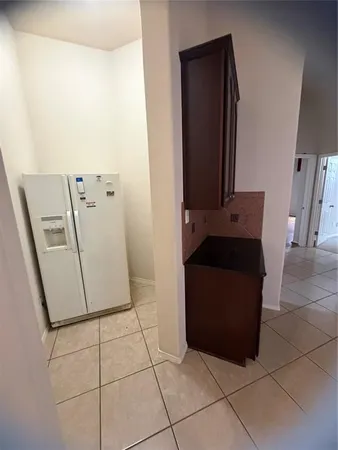 a view of staircase with lots of frames on wall and glass door